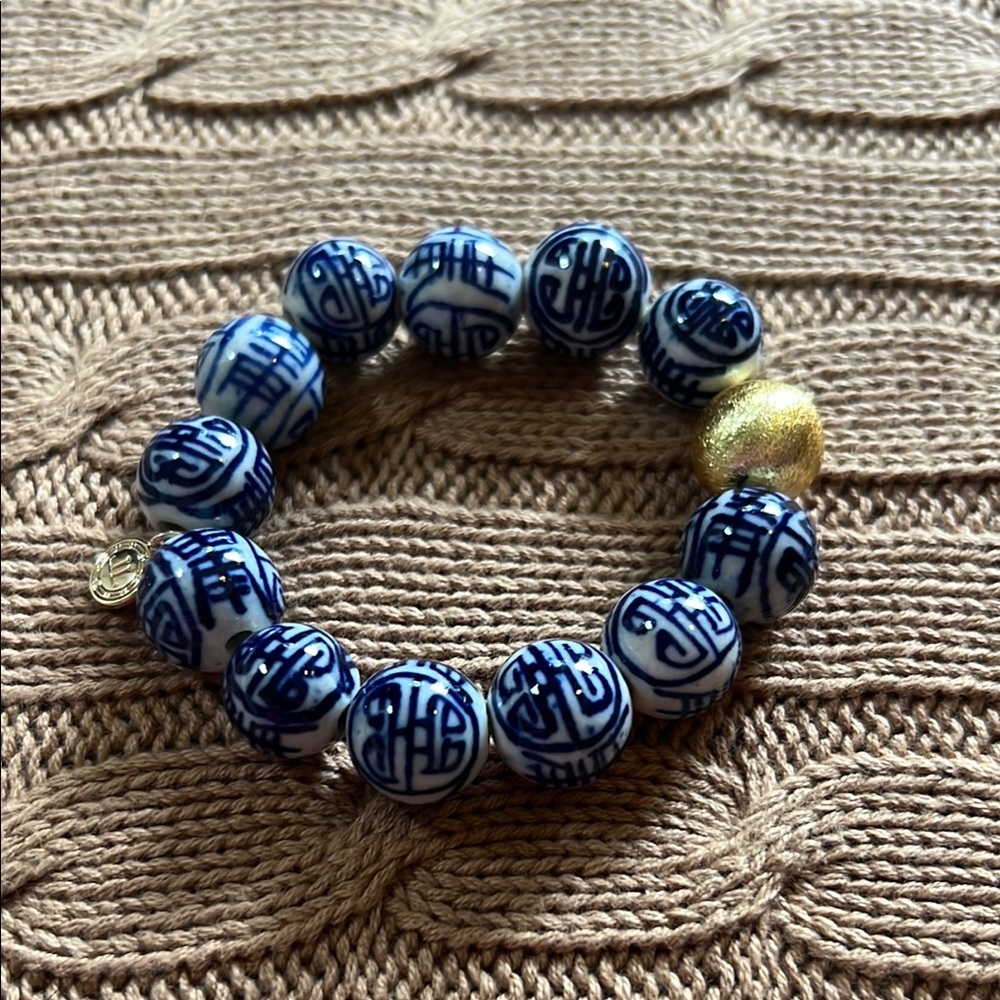 Gold and Blue Beaded Bracelet with Cultural Motifs